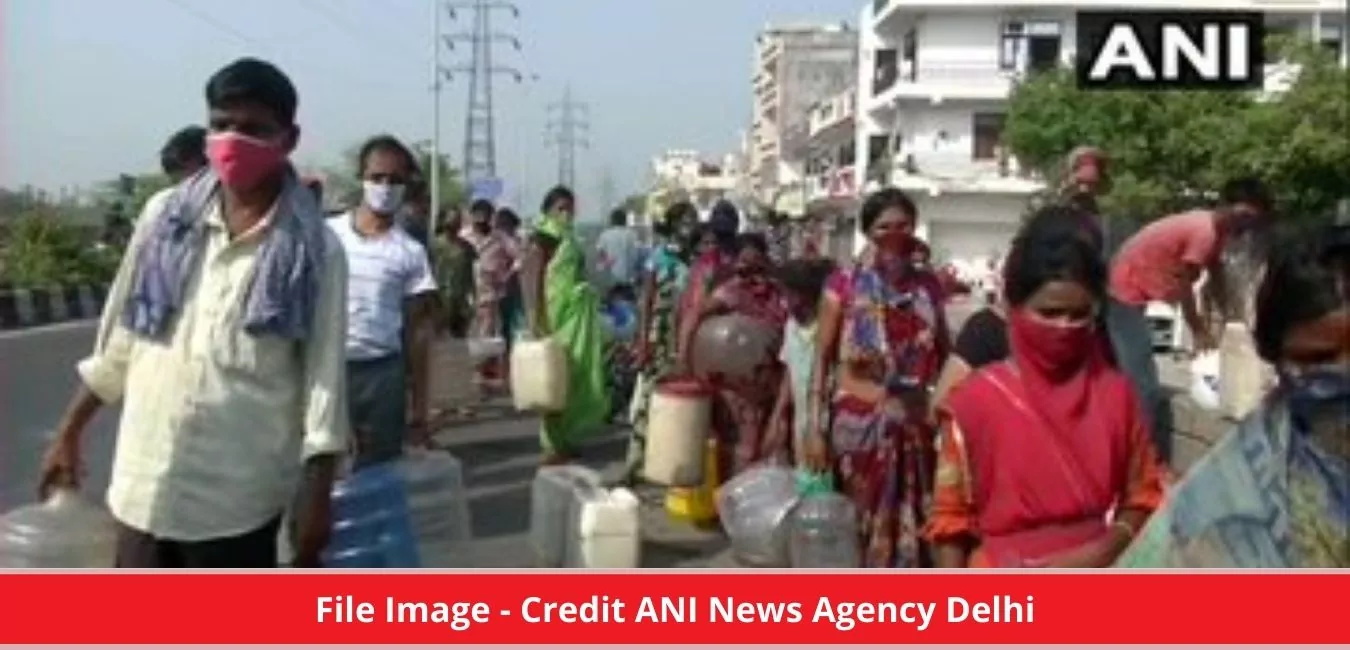 Water shortage in Chanakyapuri, People waiting for a tanker with a bucket